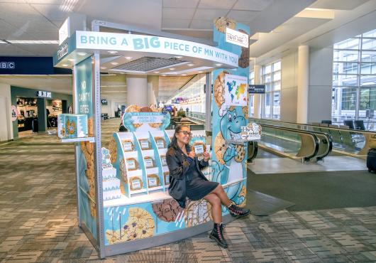 The founder of T-Rex Cookie on the sales cart.