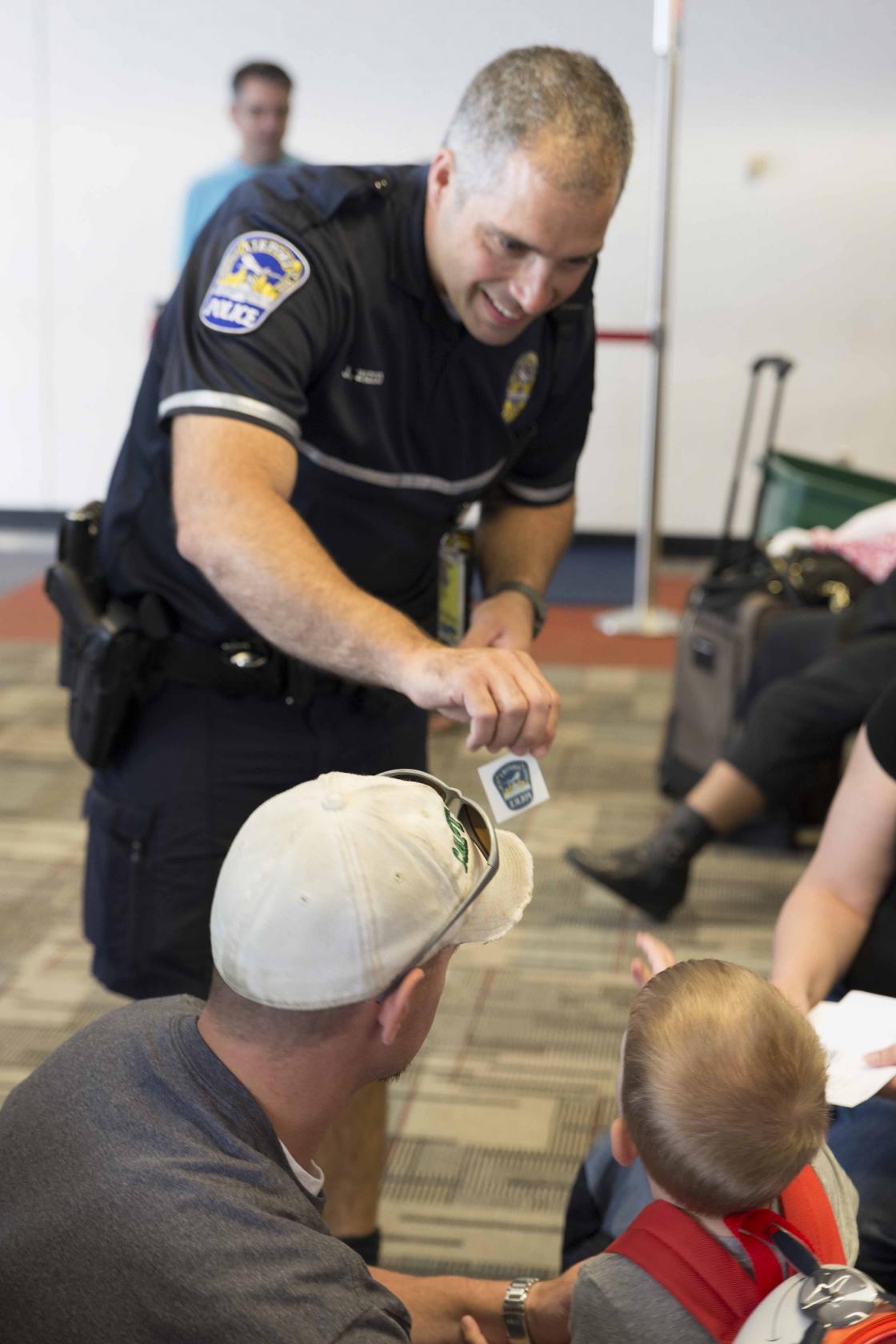 Officer handing out badge stickers