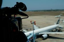 Video camera observing airplane
