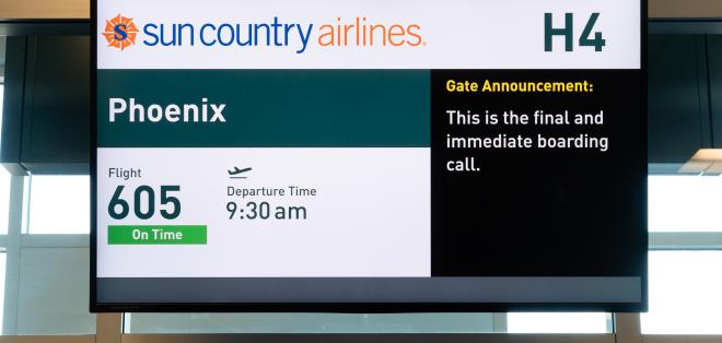 A screen showing flight information and talk-to-text transcription