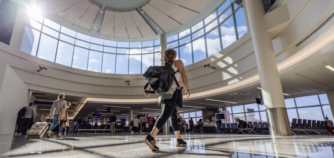 A passenger walks over a new terrazzo floor equipped with Hearing Loop Technology