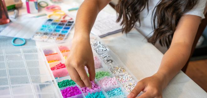 Child playing with beads